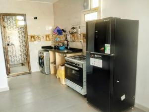 a kitchen with a stove and a refrigerator at Quiet place in Dahab