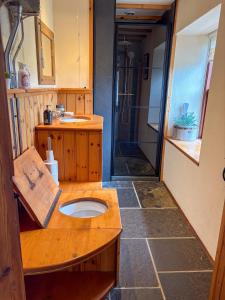 a small bathroom with a sink and a shower at The Mill O Cara in Orkney +21 photos