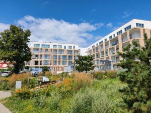 a large building with a garden in front of it at Helskafoka2 in Hel