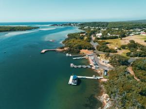 an aerial view of a river with a dock at Waterscape Floating Apartment in Augusta