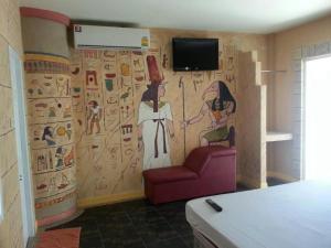 a room with a wall with a painting on it at Fancy Resort in Ban Samran