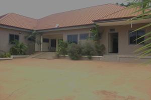 a house with a tile roof and a driveway at Anaviosi Villa in Anum