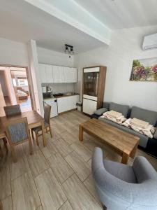 a living room with a couch and a table at VODICE KRAJE APARTMENTS in Vodice