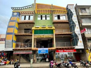 a building with motorcycles parked in front of it at Hotel Benjamin Naval in Biliran +13 photos