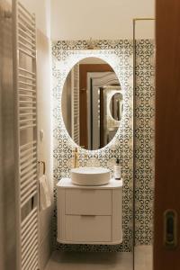 a bathroom with a sink and a mirror at Hotel Pod Zeleným Dubem in Bohumín