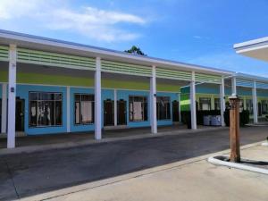 an empty building with blue and yellow at Cindia Resort in Phun Phin