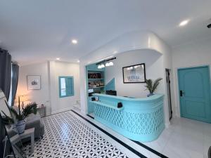a bathroom with a blue tub in a room at Luangaloun Guesthouse in Luang Prabang +56 photos