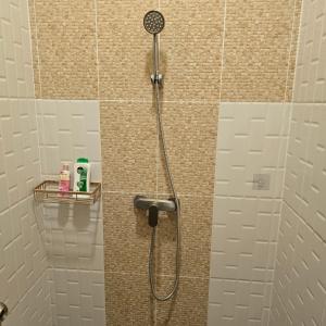 a shower with a shower head in a bathroom at Victory place 2 (Golden Mount) in Bangkok +58 photos