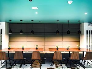 a conference room with a table and chairs at Avior Hotel in General Santos