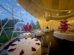 a room with tables with red roses on them at Hotel Dobczyce in Dobczyce +59 photos