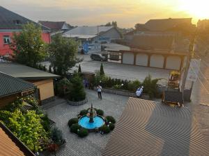 an aerial view of a courtyard with a fountain at Готель Сузірʼя in Kolomiya