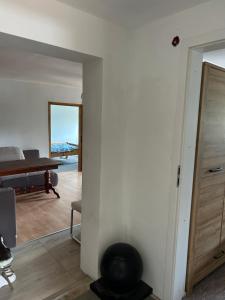 a living room with a door and a table at Dolna 64 in Strzegom