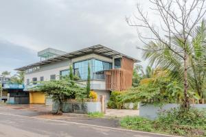 a house on the side of a street at E7 Apartment in Bekal