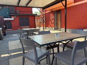 a table and chairs on an outdoor patio at Giorno&Notte Colleferro in Colleferro