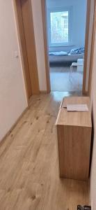 a room with a wooden table in the middle of a room at Monteurswohnung1 in Halle an der Saale