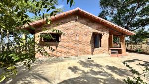 a small brick building with a window on it at AV Meadows in Kanchipuram