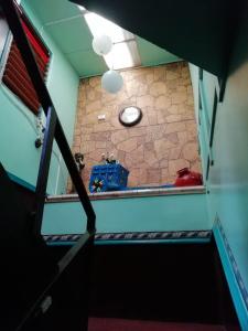 a view from the top of a stairwell of a room at Hospedaje del norte in Quesada