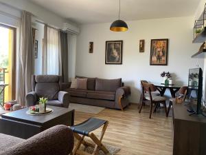 a living room with a couch and a table at Moun2 in Mavrovo