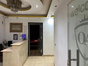 a lobby with a reception desk and a door to a room at AL Waha Cairo Hotel in Cairo