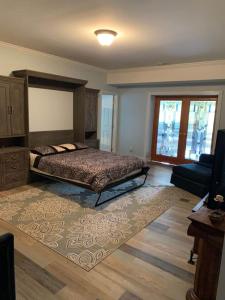 a bedroom with a bed and a large rug at Cove Manor in Maynardville