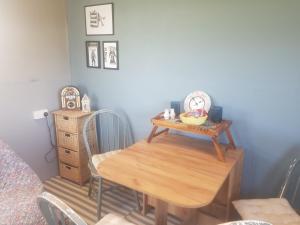 a room with a table and a chair and a desk at Tiny living on the Wild Atlantic Way in Tralee +15 photos
