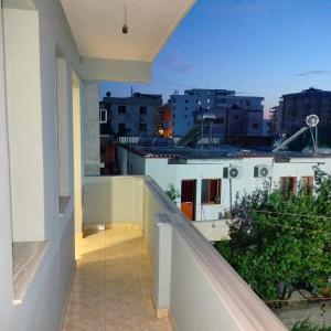 a balcony with a view of a city at Beach Guest House in Durrës