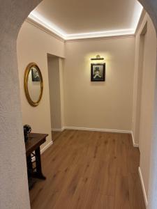 an empty hallway with a table and a mirror at Hotel Medici in Milazzo +30 photos