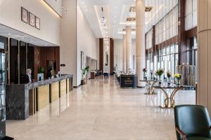 an empty lobby of a building with a lobby at Warwick Al Baha Hotel in Baljurashi +69 photos