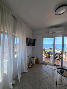 a living room with a view of the ocean at Apartman NoTi in Milna