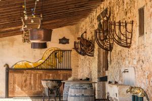 a room with a harpsichord on the wall at Domaine de Gaillac in Sauclières