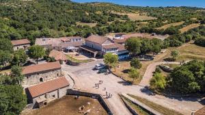 an aerial view of a farm with a building at Domaine de Gaillac in Sauclières