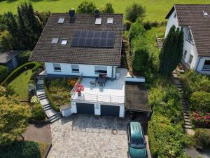 an aerial view of a house with a solar roof at FEWO Zum Golfplatz in Lügde