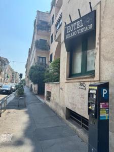 a parking meter on the side of a building at Hotel Vintage Milano Centrale in Milan