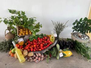 a display of fruits and vegetables on a table at Tenuta La Picola in Furore