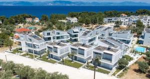 an aerial view of a large white apartment building at Viasol Suites Thassos in Skala Rachoniou