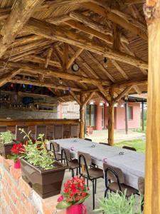 a patio with a table and chairs in a pavilion at Vila Vida in Kruševac