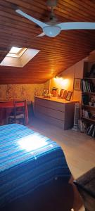 a bedroom with a bed and a ceiling fan at Domaine de Béchegut in Marval