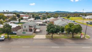 an aerial view of a city with houses and a street at Maynestay Motel in Gunnedah
