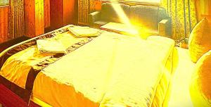 a bed in a room with at The Trisha Hotel in kolkata