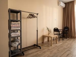 a room with a room with a shelf and a table at Студия у чистейшего Моря! in Gonio
