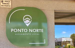a sign for a porto nordic sign in front of a building at AL Ponto Norte in Melgaço