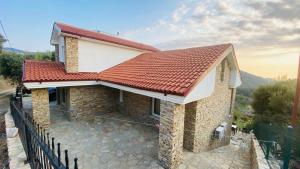 a house under construction with a red roof at Iztuzu Sunset Villa in Gökbel