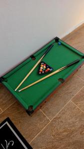 a pool table with cue balls on top of it at Mista apartment in Peyia