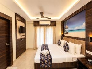 a hotel room with a bed and a window at Hotel Rohit Rohini - New Aesthetic Hotel in Jagannath Puri with Restaurant, Parking, Free Wi-fi, Prime Location in Puri +16 photos