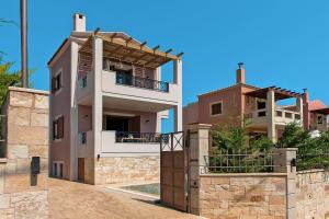 an image of a house with a building at Cottage in Adele in Ádhele