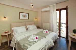 a bedroom with a large bed with towels on it at Cottage in Adele in Ádhele