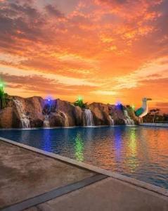 a painting of a water park with a waterfall at Casa playa el Retén 