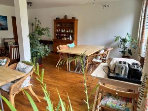 a living room with a table and a dining room at Normandy Inn in Montbray +31 photos