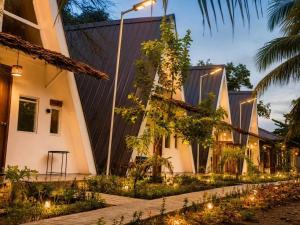 a row of houses with lights in front of them at Sunset Villas Palauig Zambales in Palauig
