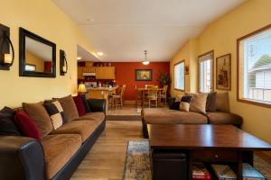 a living room with a couch and a table at Suite Serenity Condo by NW Comfy Cabins in Leavenworth +47 photos